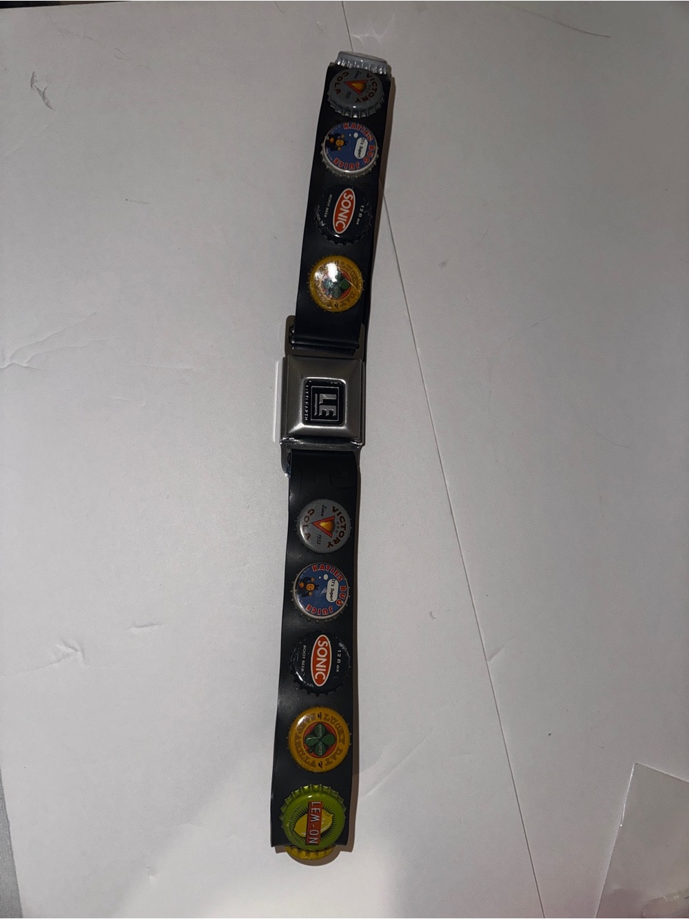 Little Earth Black Seatbelt-Style Belt with Colorful bottle top Accents